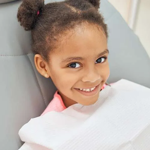 Girl smiling during her pediatric dental exam at Canton Children's Dentistry