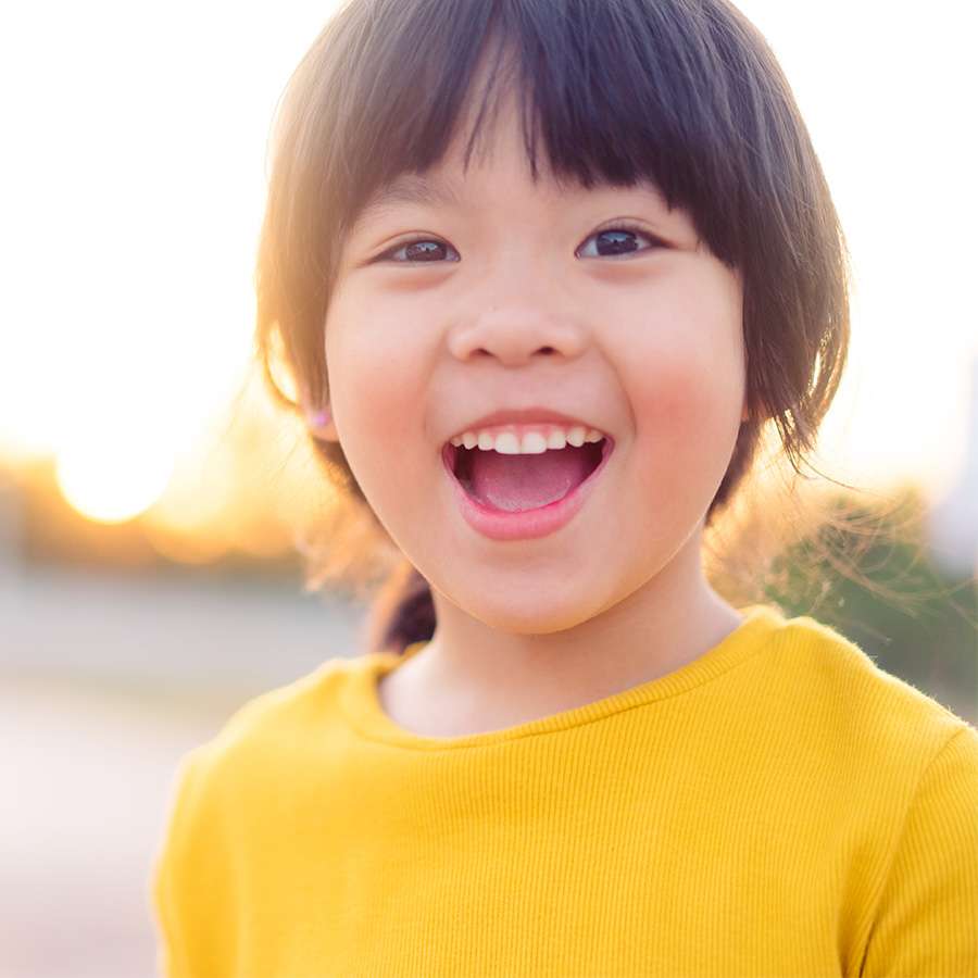 Girl smiling after her pediatric dental exam at Canton Children's Dentistry